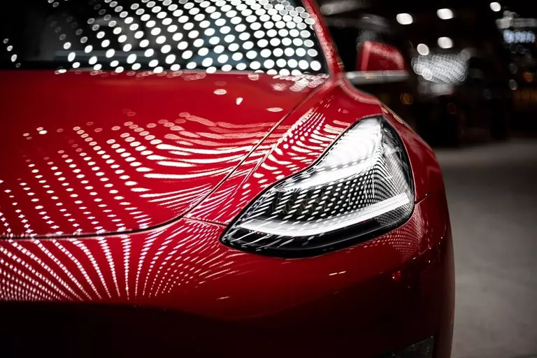 tesla-car-red-front-light-view-closeup